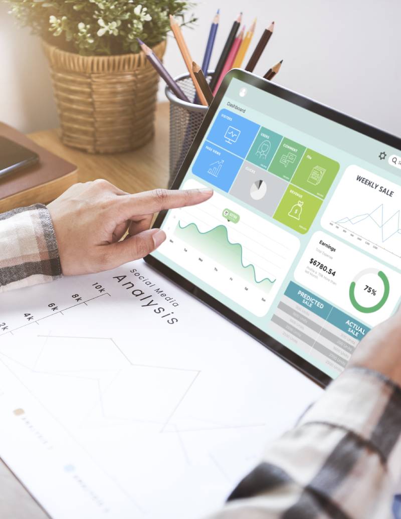 businesswoman using tablet to analyze company finance graphs